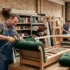 Sofa makers near me working on custom wooden sofa manufacturing and upholstery in a furniture workshop