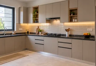 Low budget interior design featuring a completed modern modular kitchen with neutral laminate cabinets and granite countertop