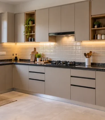 Low budget interior design featuring a completed modern modular kitchen with neutral laminate cabinets and granite countertop