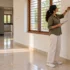 Designer measuring an empty room for new house interior design before moving in