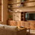 Wall decor for living room with teak wood shelving, closed lower cabinets and open display shelves